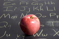 Photo of an apple on a blackboard
