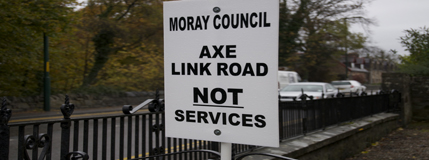 western link road - axe link road sign Image showing protest sign