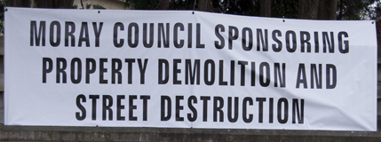 western link road - sponsoring property demolition Image showing protest sign